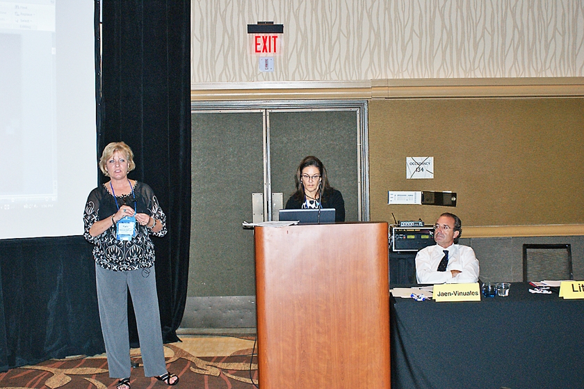 DSC03584.JPG - Cathy Ates (from left), immediate past president of the Florida Association Directors of Nursing Administration/LTC, presents the LTC directors of nursing and administrators‚Äô points of view at the Basic Training course with Martha Little (at podium), PharmD, and Dr. Jaen-Vinuales, looking on.
