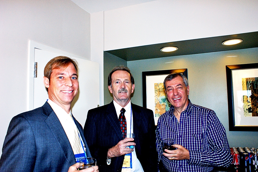 DSC03640.JPG - Chris Gregg (from left) and Jim Jackson with American Health Associates with Dr. Jim Lett, past president of FMDA and AMDA