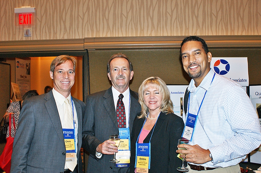DSC03667.JPG - Chris Gregg, Jim Jackson, and Debbie Martin (from left to right) of American Health Associates with FMDA Director Dr. Karl Dhana at the Welcome Reception