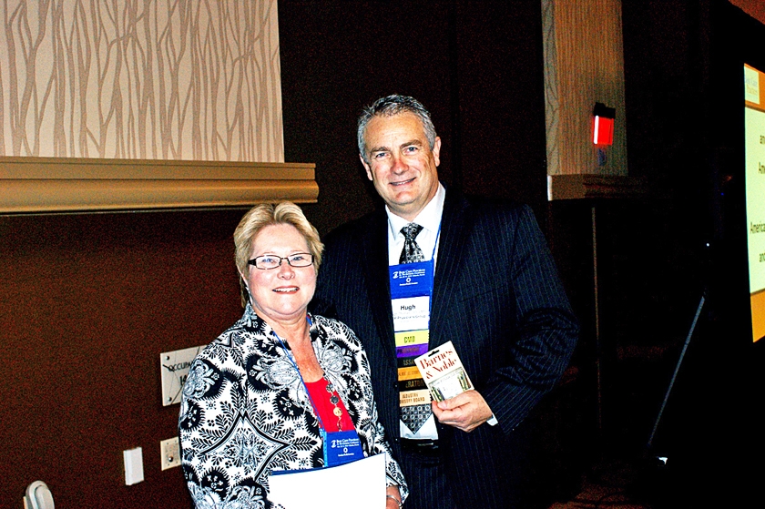 DSC03785.JPG - FMDA President Dr. Hugh Thomas (right) with first-place poster presenter winner Charlene Demers, GNP-BC