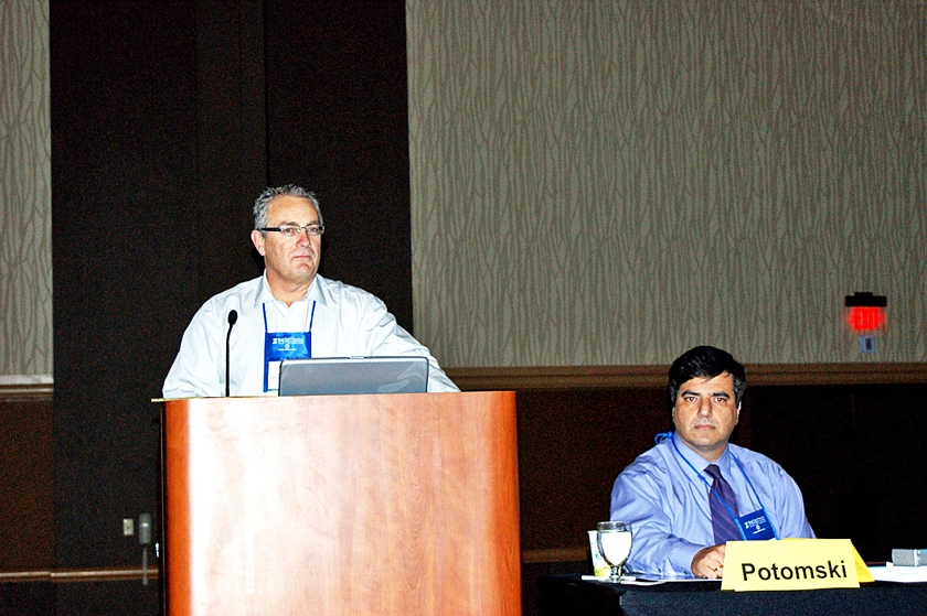 DSC03878.JPG - FMDA President Dr. Hugh Thomas (left) with Dr. John Symeonides during the annual membership meeting