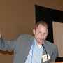 Dr. Brian Kiedrowski announcing some housekeeping items during a morning session